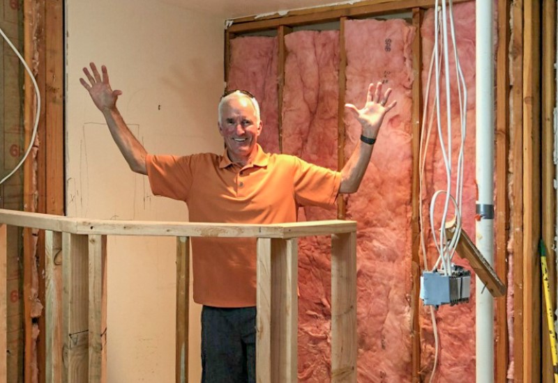 Homeowner standing in framing of future shower during whole home remodel, Golden Rule Remodeling & Design, Salem Oregon