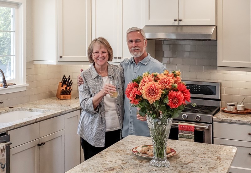 Homeowners enjoying completed kitchen remodel, Golden Rule Remodeling & Design, Silverton Oregon